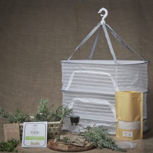 Hearth & Larder Herb Preservation Kit with drying net, glass jars, muslin bags, seed saving bags, coarse salt, grinder, and guide booklet